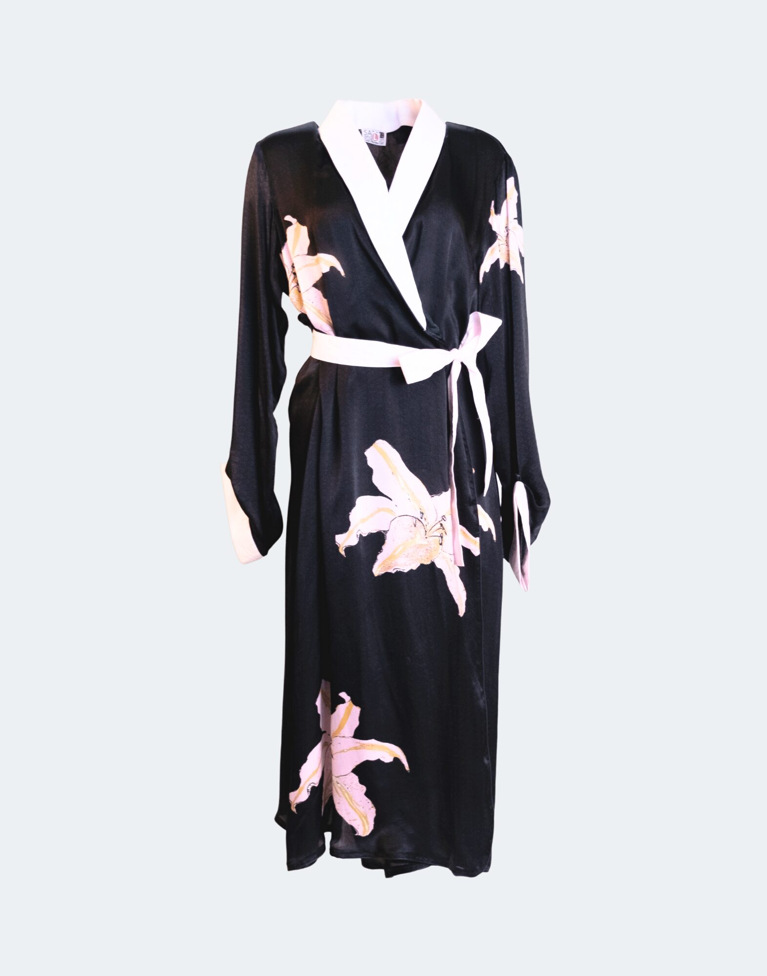 black patterned robe covered in pink lilies