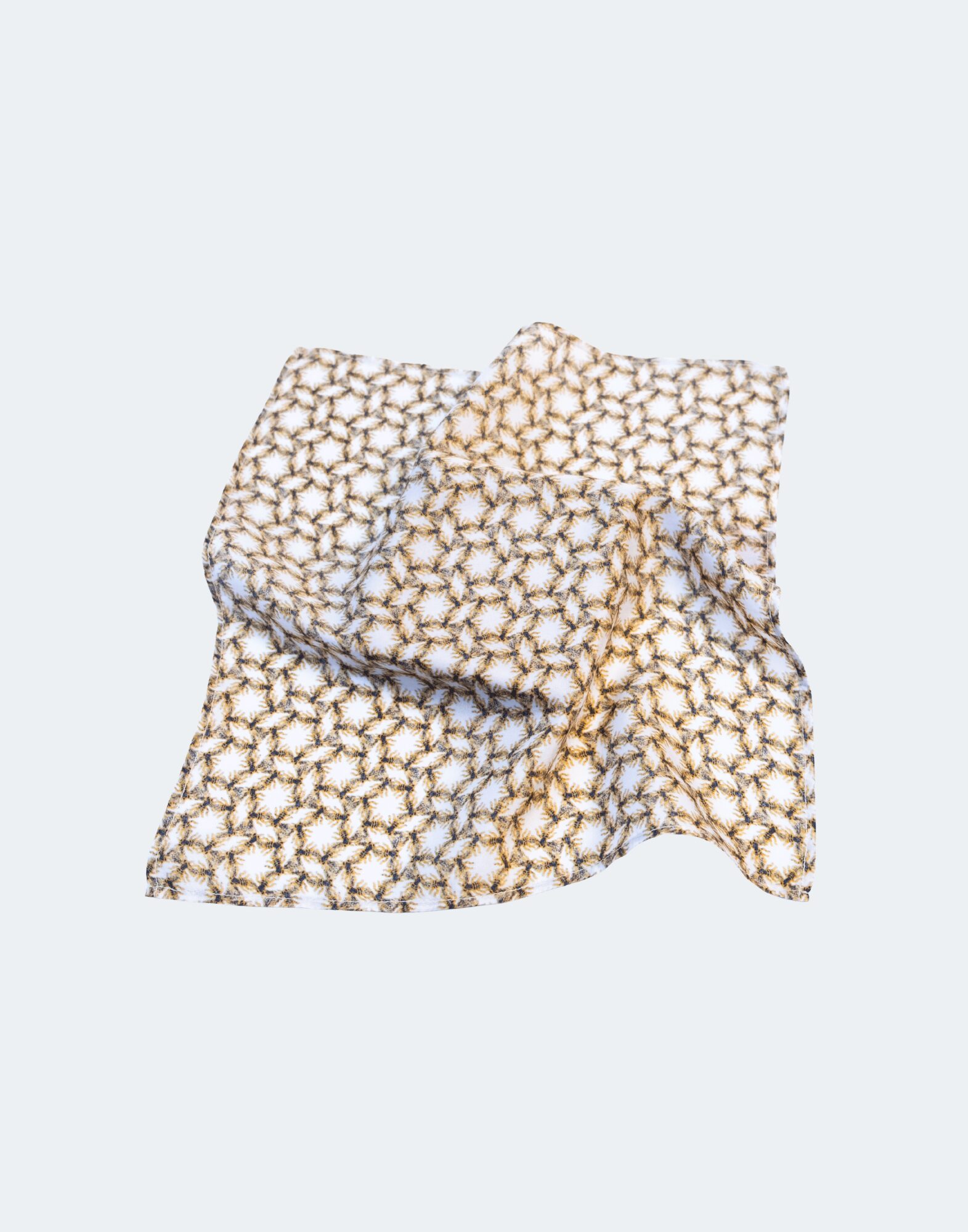 white and gold patterned flat lay pocket square
