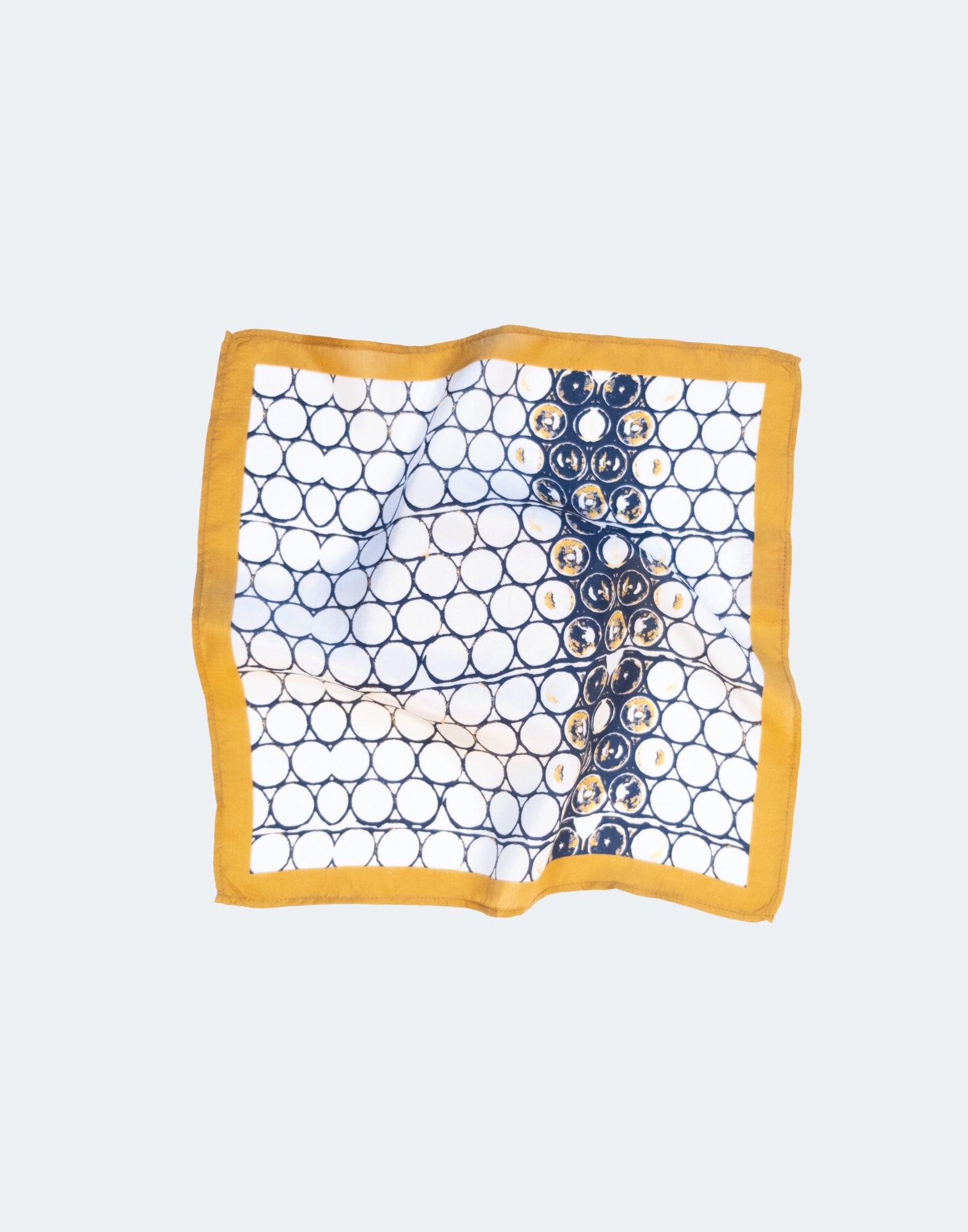 pocket square laid flat with circular pattern and gold border